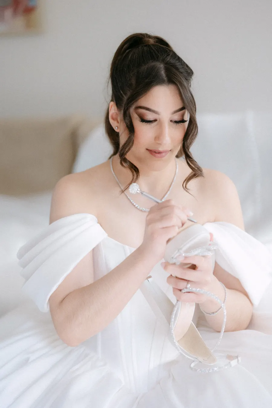 Bride, seated portrait with glam makeup